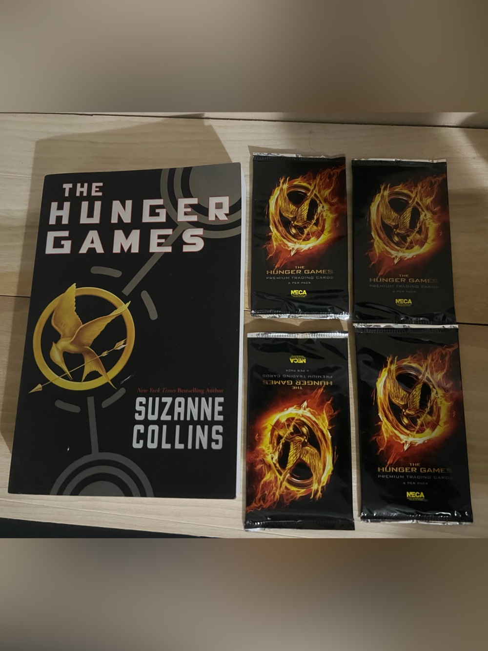 The Hunger Games book and 4 Collector Card Packs